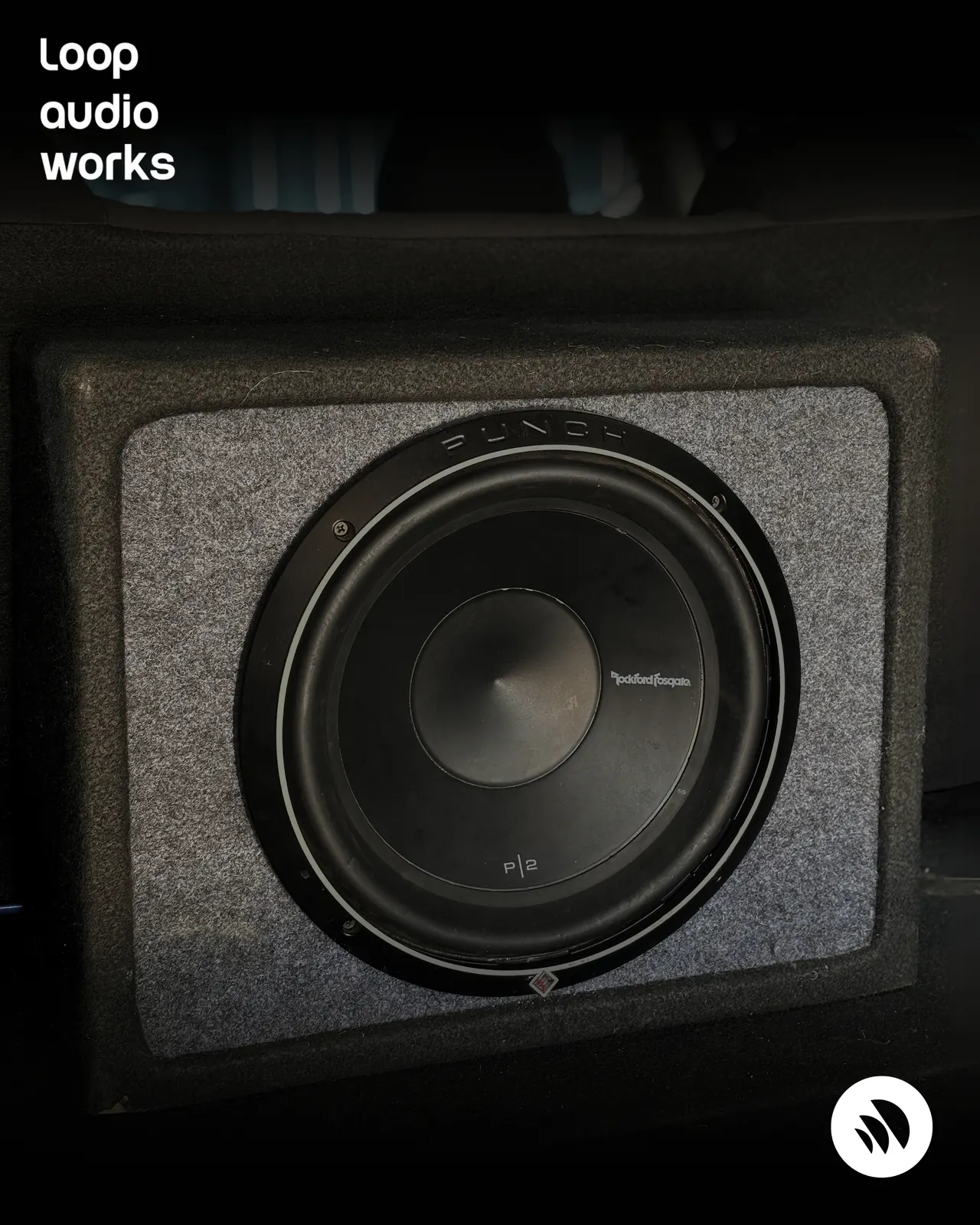 Custom sealed subwoofer enclosure installed in a Kia car boot in Coimbatore.